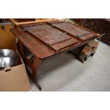 A traditional dark stained pine kitchen table in the farmhouse style, length approx. 138cm, plus 2 x