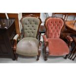 A matched pair of Victorian stained frame 'his and hers' low seat armchairs having button back