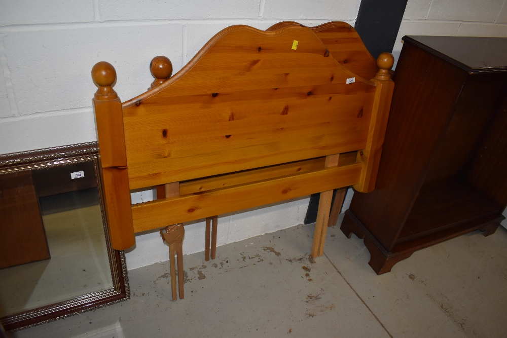 A pair of pine single headboards