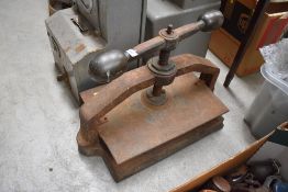 A vintage cast book press