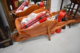 A selection of miscellaneous including small wooden wheel barrow, wall brackets and fire
