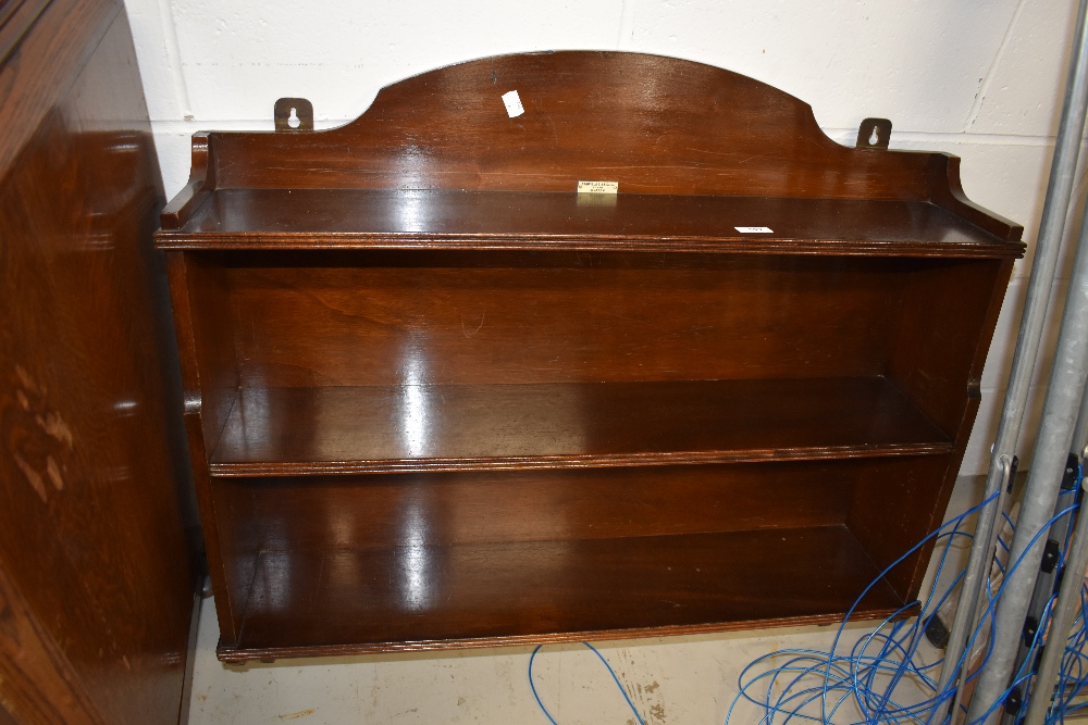 An early 20th Century mahogany wall shelf, labelled Fairfield, Glasgow, approx width 85cm