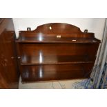 An early 20th Century mahogany wall shelf, labelled Fairfield, Glasgow, approx width 85cm