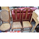 A pair of Edwardian mahogany cane seated bedroom chairs having line inlay decoration