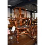 A traditional oak rocking chair, nicely restored