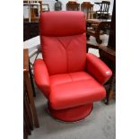 A modern (2015) retro style red leather or leatherette swivel recliner chair on chrome frame, get