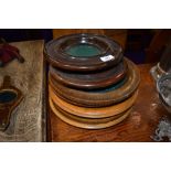 A selection of hand turned ecclesiastical collection or offering plates,including oak and teak.