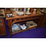 A ecclesiastical church vestibule or console table having gothic design in pitch pine