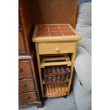 A modern beech and tile top kitchen trolley, approx. 37cm