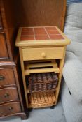 A modern beech and tile top kitchen trolley, approx. 37cm