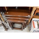 A lovely quality reproduction (Reprodux) nest of three traditional oak tables, in excellent