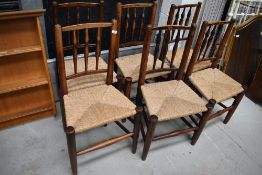 A set of six 19th Century oak rush seated kitchen/dining chairs, in a very primitive style