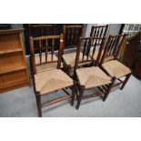 A set of six 19th Century oak rush seated kitchen/dining chairs, in a very primitive style