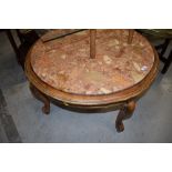 A traditional continental style circular coffee table having rouge marble inset top, width approx.