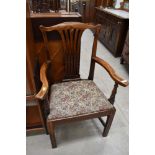 A 19th Century stained frame arm chair having splat back and upholstered seat