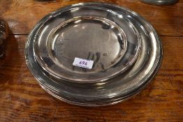 A collection of six silver plated communion or similar platters