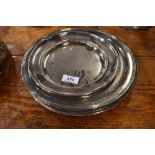 A collection of six silver plated communion or similar platters