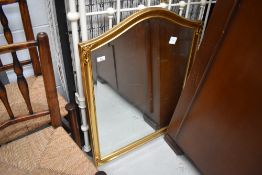 A modern gilt frame mirror having shaped top, 89 x 69cm