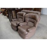 A vintage light brown leather three seater settee and two chairs