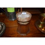 An ecclesiastical ceremonial bowl in a carved stone with hexagonal oak plinth