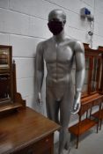 A life size 'male' manequin, silver base colour, height 186cm