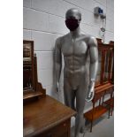 A life size 'male' manequin, silver base colour, height 186cm