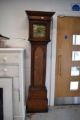 An18th Century and later oak longcase clock, having 8 day movement, 25cm brass and silvered dial,