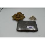 A West Riding Brass Helmet plate with clasp, a United Services Corps brass Cap Badge and a white