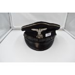 A WW2 SS Allgemeine Visor Cap with badges, named and SS emblem inside, size 58