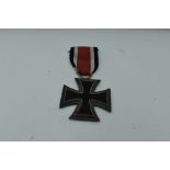 A German WW2 Second Class Iron Cross, Swastika and 1939 on face, 1813 on reverse, with ribbon,