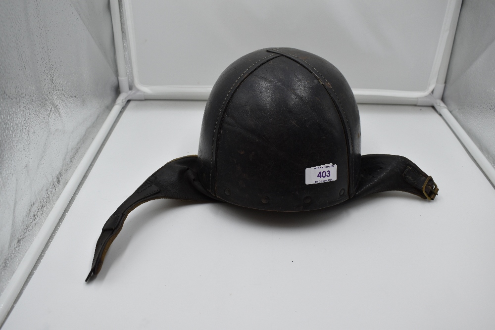 A British WW2 leather Dispatch Riders Helmet, repolished in black, size 6 3/4, JH Ltd, 1942