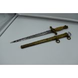 A German WW2 period Kriegsmarine Dagger with scabbard by Puma Solingen, handle chipped, two small