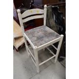 A white work bench or similar stool