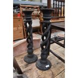 A pair of rustic wooden open twist candlesticks, height approx. 55cm