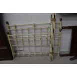 A cast bed frame in the Victorian style, width approx, 144cm