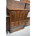 An oak television or music cabinet having open front with storage underneath by Old Charm