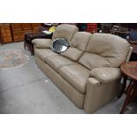 A vintage light brown leather three seater settee, possibly G plan
