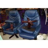 A pair of stressless style armchairs and footstools in dark blue