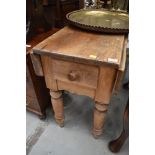 A traditional pine kitcen table having short drop flaps and frieze drawer, width approx. 91cm