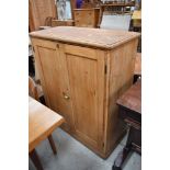 A stripped pine cupboard, approx. dimensions W85 H100 D38cm
