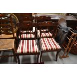 A set of four reproduction mahogany rail back dining chairs