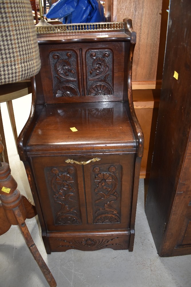 A Victorian mahogany coal purdonium