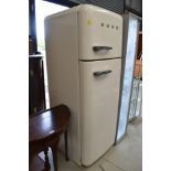 A modern cream Smeg kitchen fridge