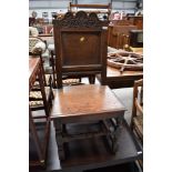 A period oak hall chair having panel and carved back, seat width approx. 48cm