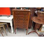 An early 20th Century mahogany and inlaid music cabinet, having six drawers, width approx. 54cm,