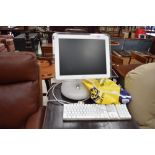 An Apple iMac desktop computer and accesories, serial number W8352078QB6