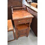 A Victorian mahogany pot cupboard, in the Aesthetic style, labelled Starkey and Meild ,