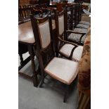 An Edwardian mahogany and inlaid salon armchair and matching chair