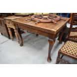 A traditional oak drawer leaf table , on Queen Anne style legs