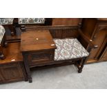 An Old Charm oak framed telephone table with integral drawer